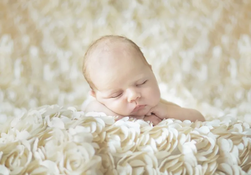 Konrad Bak: Baby sleeping in the Roses